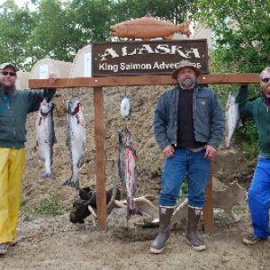 a nushagak river king/chinook salmon fishing group gathers around at our alaskan fishing lodge