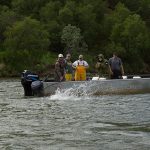 a boat with a "fish on" nushagak river style